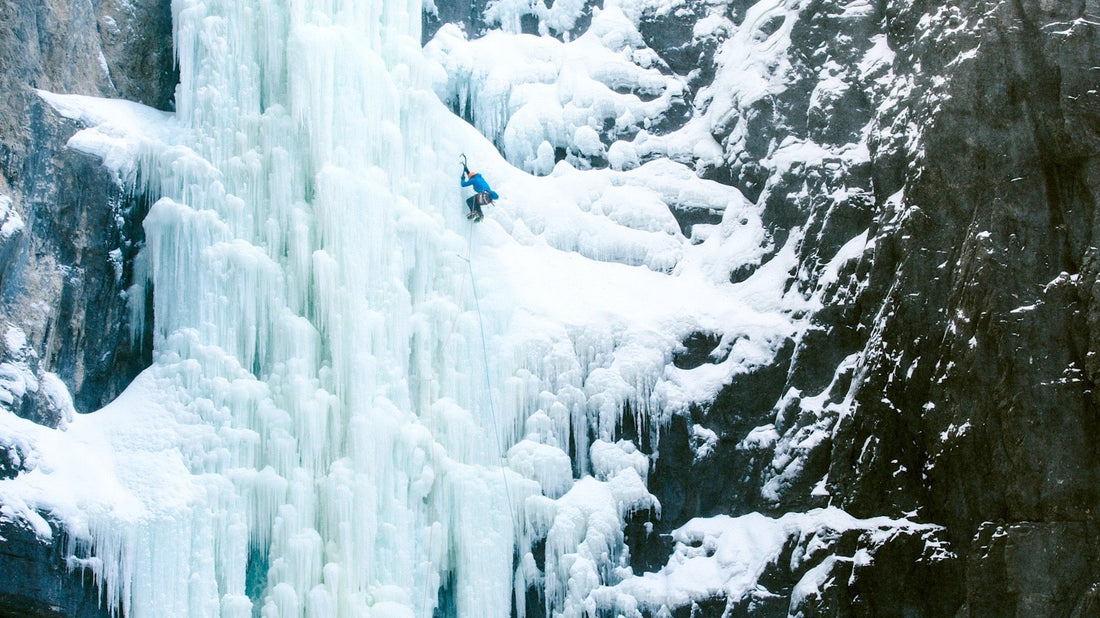 Climber climbs Ice in the wilderness